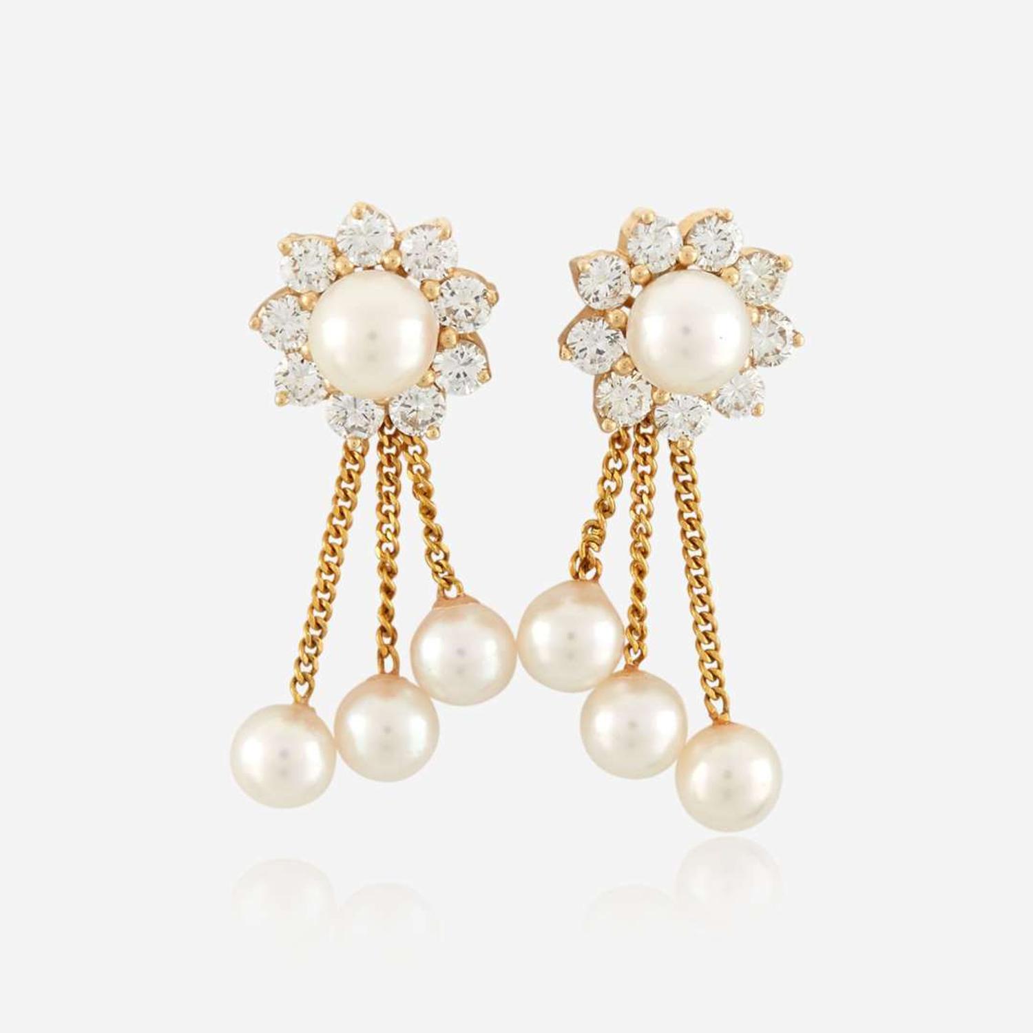 A pair of cultured pearl, diamond, and gold earrings
