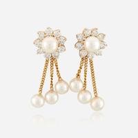 A pair of cultured pearl, diamond, and gold earrings