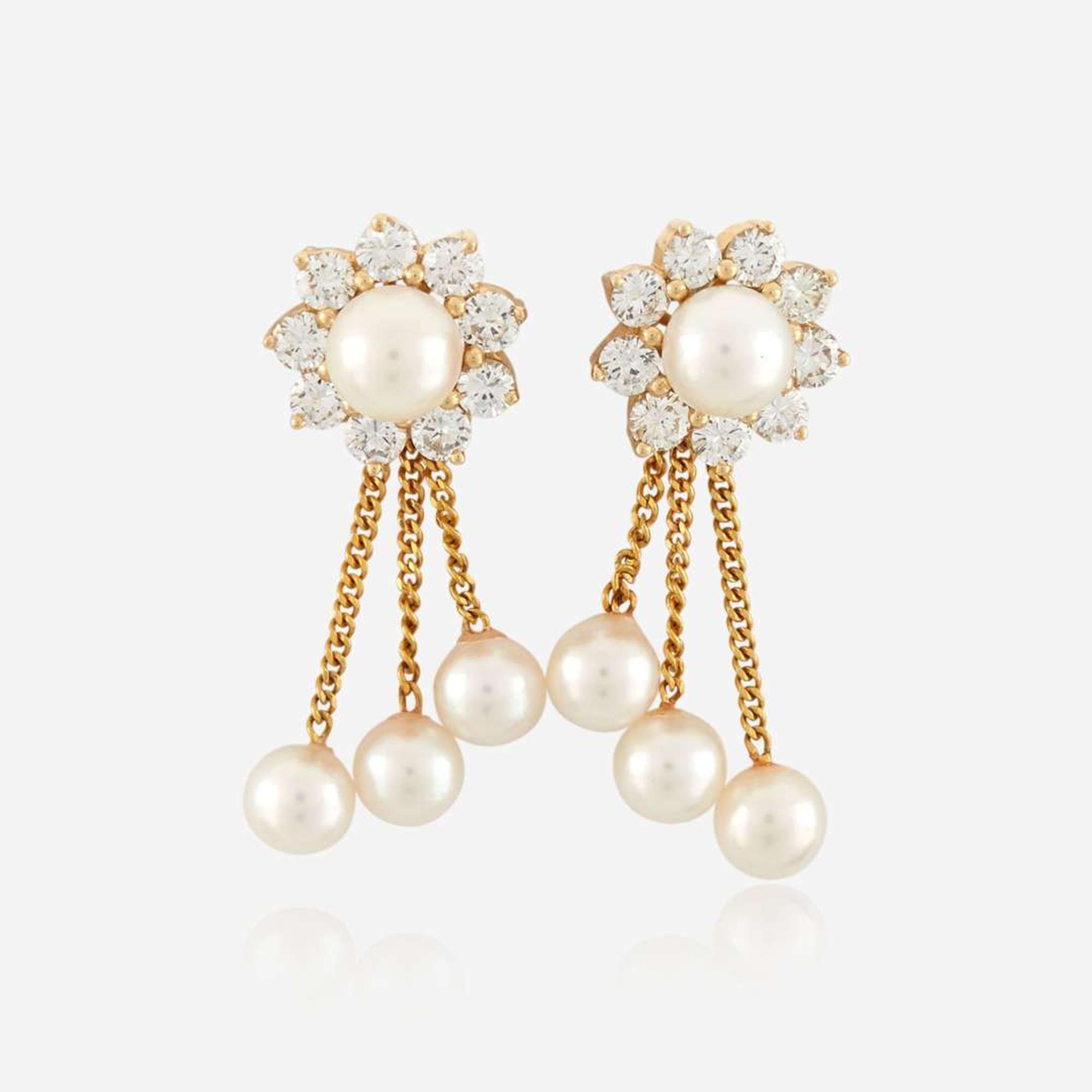 A pair of cultured pearl, diamond, and gold earrings