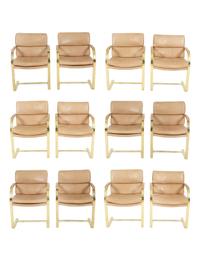A Set of Twelve Gilt Steel Dining Chairs with Leather Upholstery