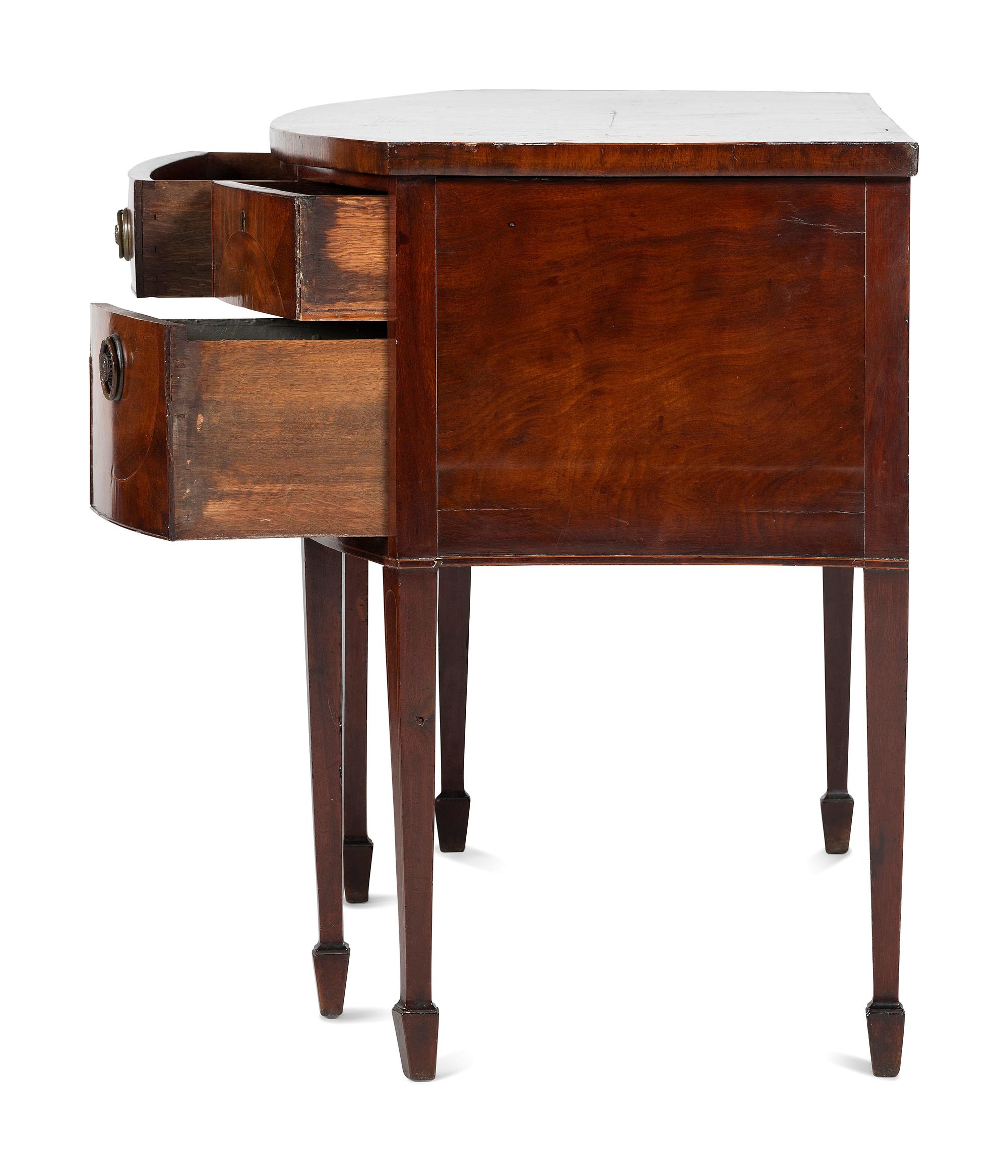 A Regency Carved, Inlaid and Figured Mahogany Bowfront Sideboard
