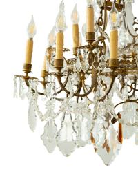 A Louis XV Style Gilt Bronze and Cut Glass Twelve-Light Chandelier