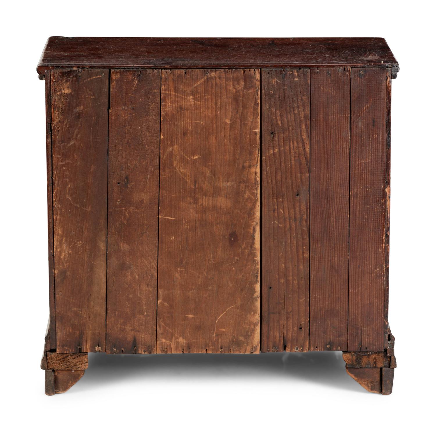 A Diminutive Walnut Chest of Drawers