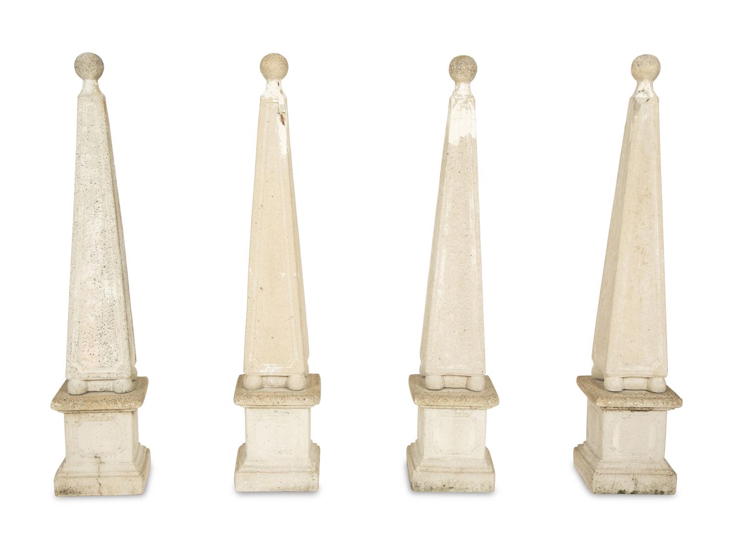A Set of Four Cast Stone Obelisks