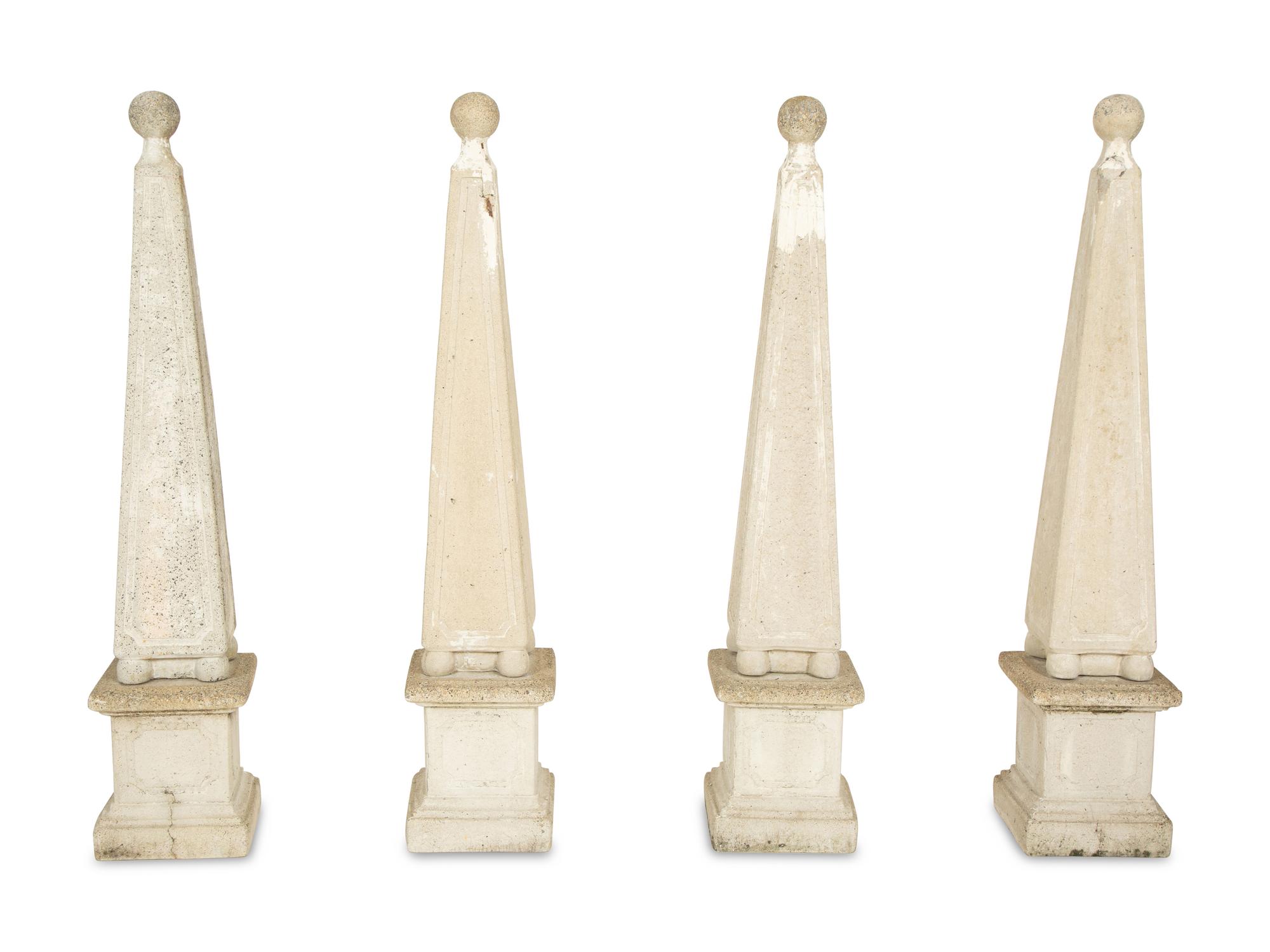 A Set of Four Cast Stone Obelisks