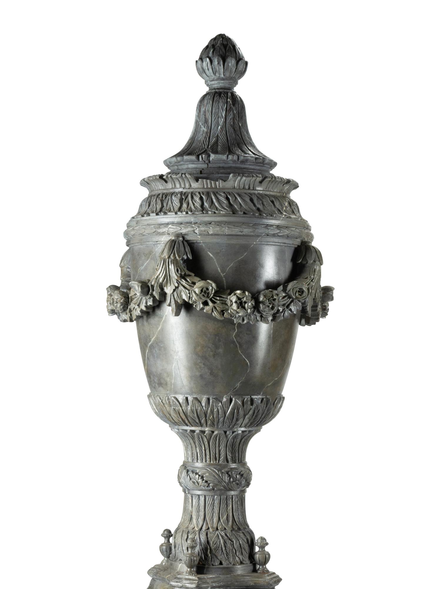 A Pair of Monumental Italian Carved and Faux Marble Painted Urns on Stands