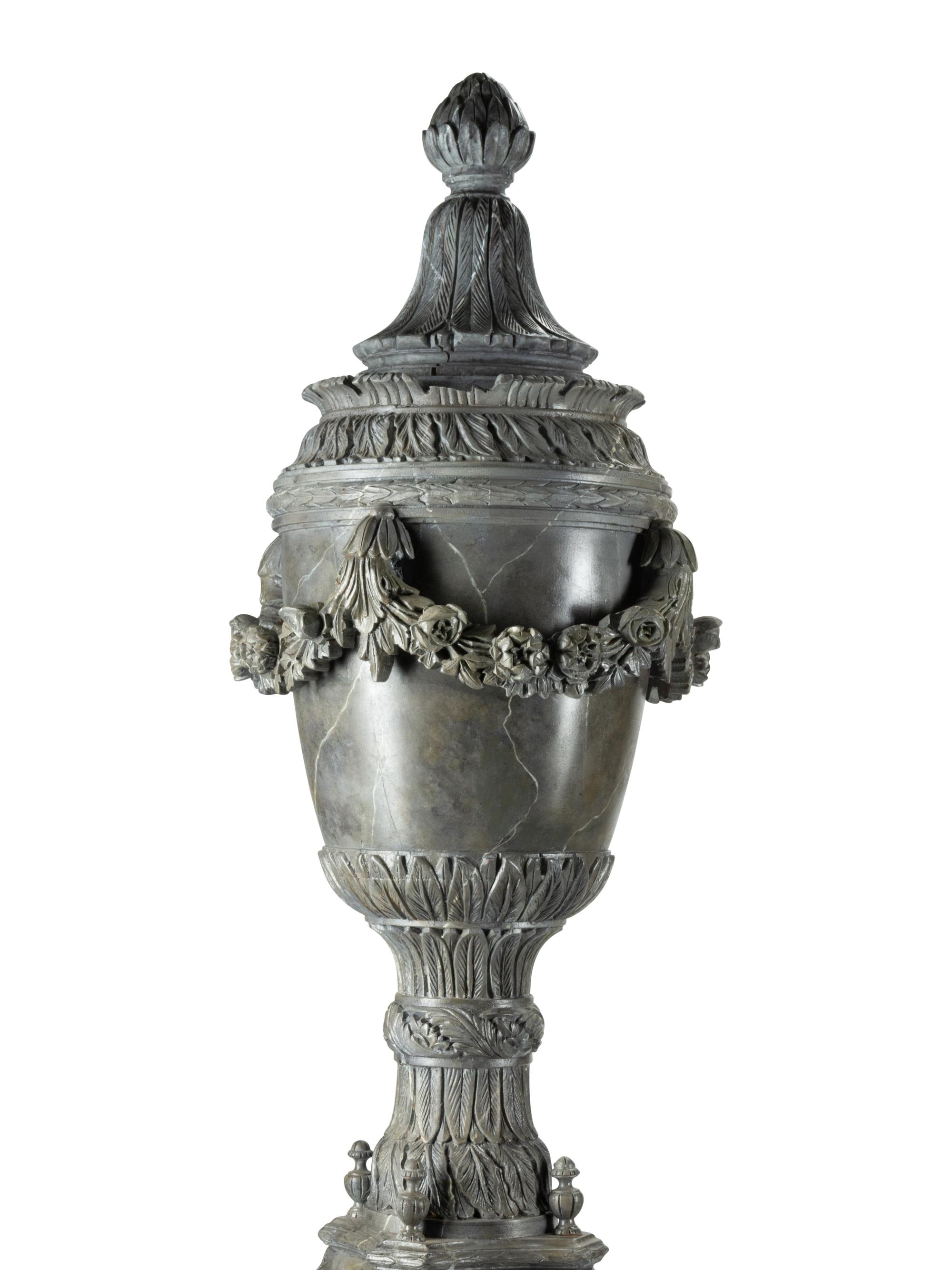 A Pair of Monumental Italian Carved and Faux Marble Painted Urns on Stands