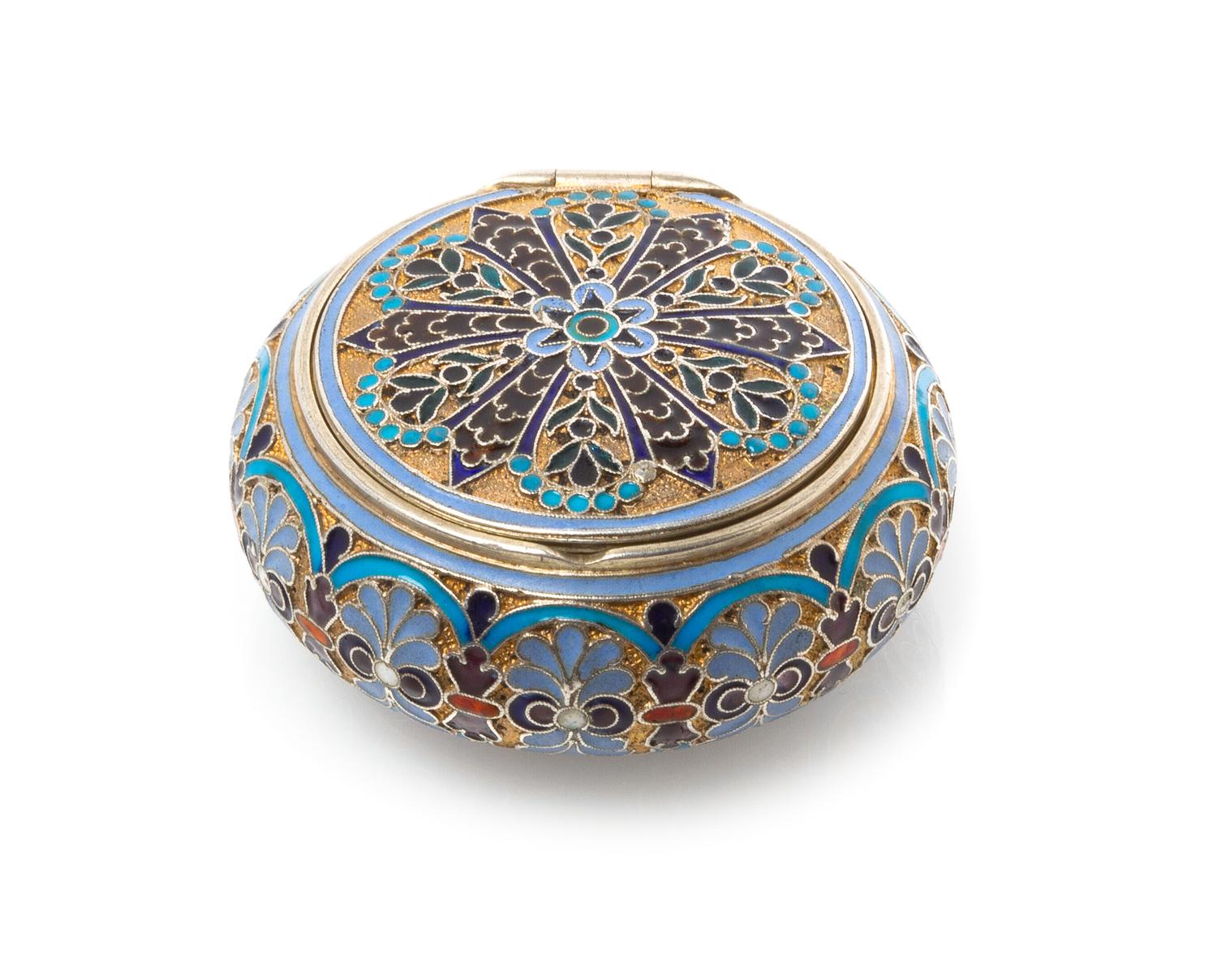 A Russian Silver and Enamel Snuff Box, Mark of Antip Kuzmichev, Moscow, early 20th century, or circular form, the case having a matted