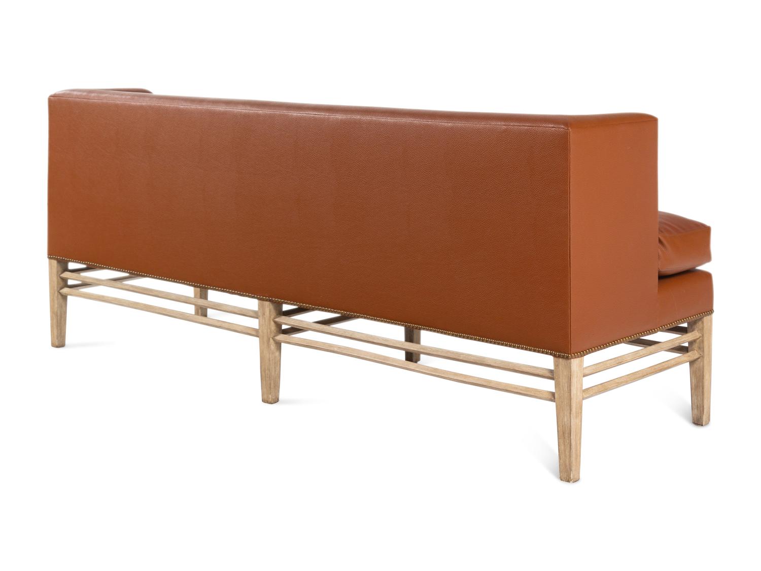 A Contemporary Faux Leather Upholstered Sofa
