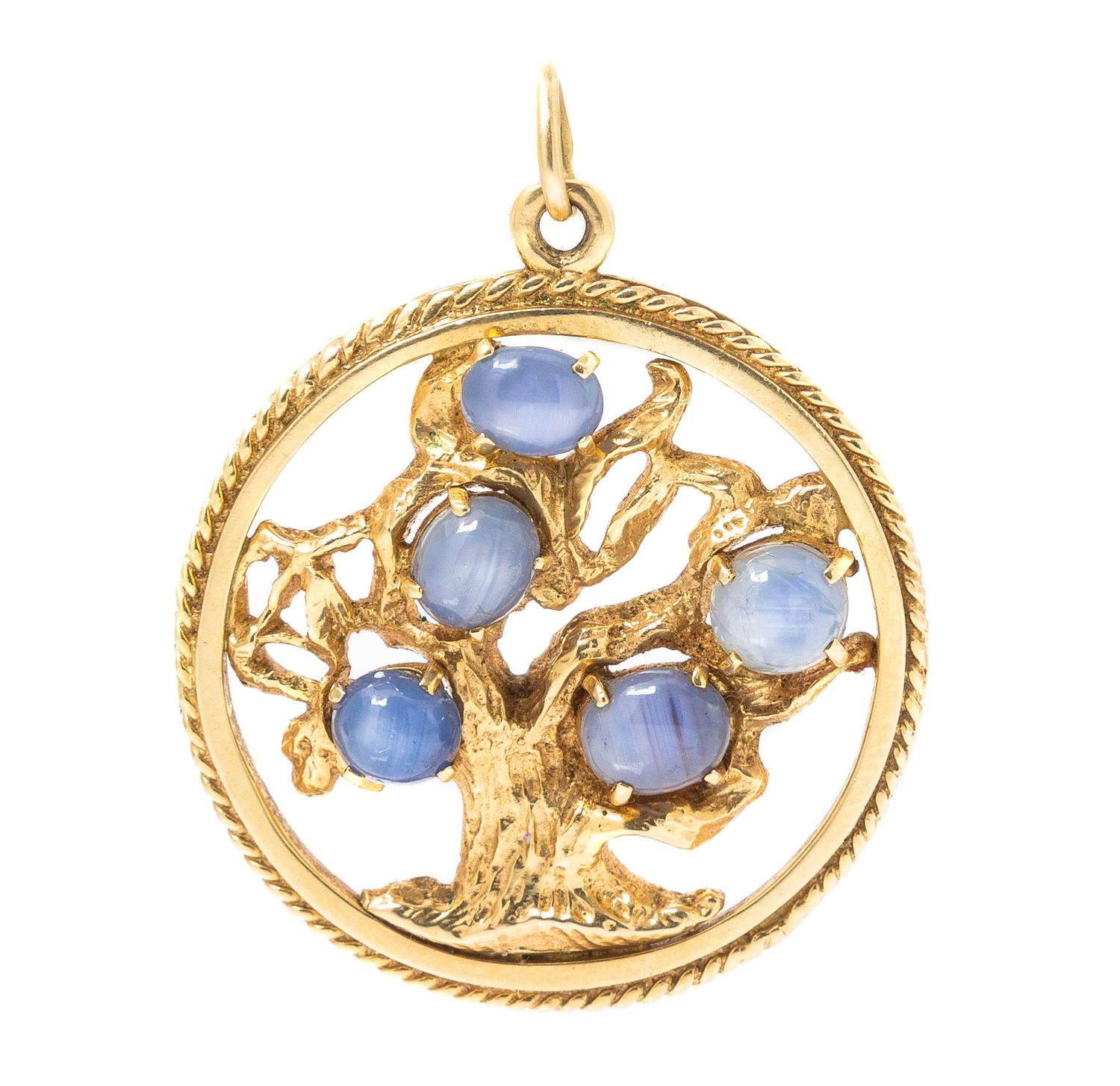 A 14 Karat Yellow Gold and Star Sapphire Tree of Life Pendant, 13.60 dwts.