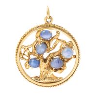 A 14 Karat Yellow Gold and Star Sapphire Tree of Life Pendant, 13.60 dwts.