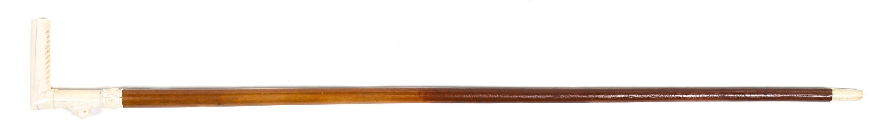 A Continental Carved Ivory Cane Handle, Height overall 35 1/2 x width of handle 4 1/4 inches.