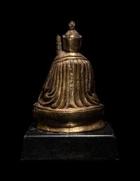 A Tibetan Gilt Bronze Figure of a Priest