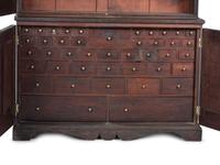 A Chippendale Style Walnut Paneled Step Back Cupboard