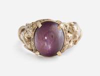 A Men's 10K Yellow Gold and Star Ruby Ring