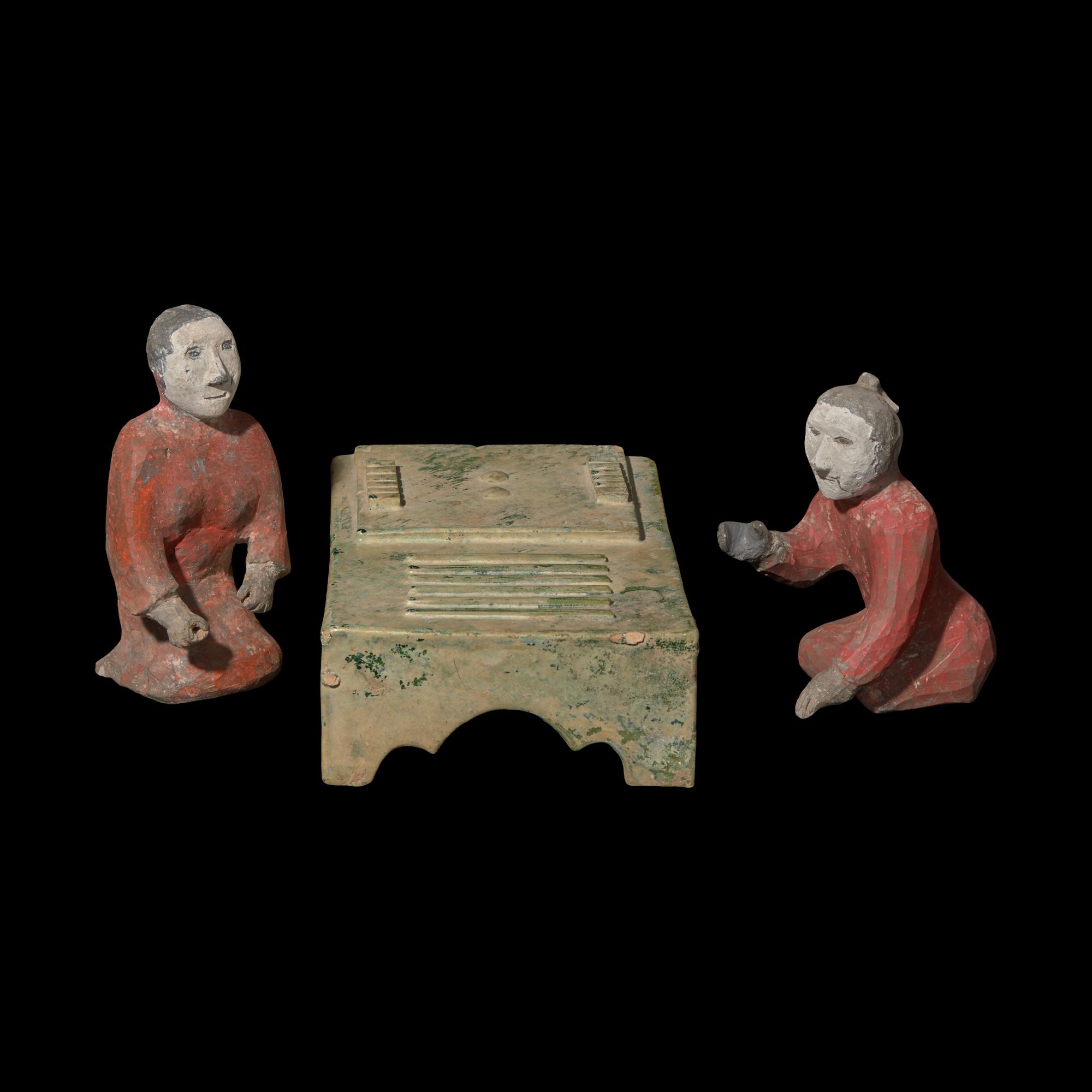 Two Chinese Painted Pottery Figures of Kneeling Liubo Players and A Green Glazed Pottery Model of a Game Board, Liubo, Han Dynasty 漢 彩繪陶六博對弈俑及博局盤