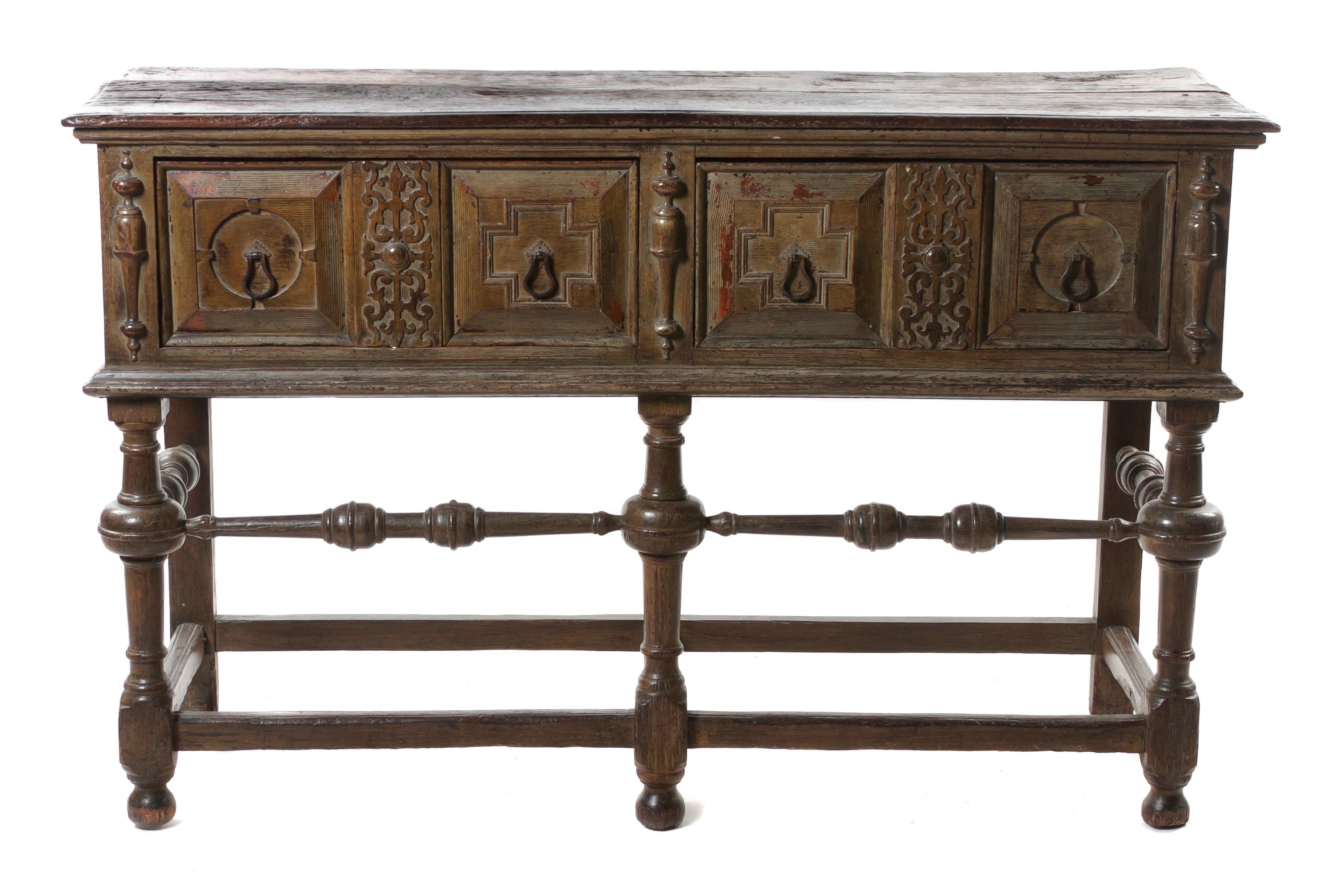 A Charles II Oak Server, Height 36 1/4 x width 58 x depth 19 3/4 inches.