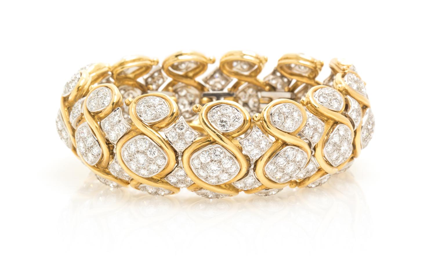 A Vintage 18 Karat Two Tone Gold and Diamond Bracelet, 84.50 dwts.
