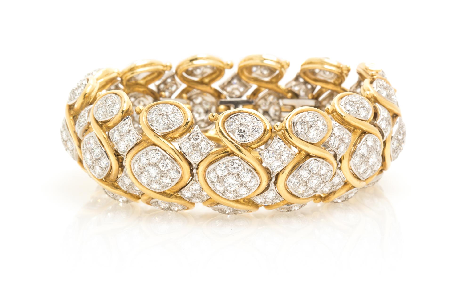 A Vintage 18 Karat Two Tone Gold and Diamond Bracelet, 84.50 dwts.