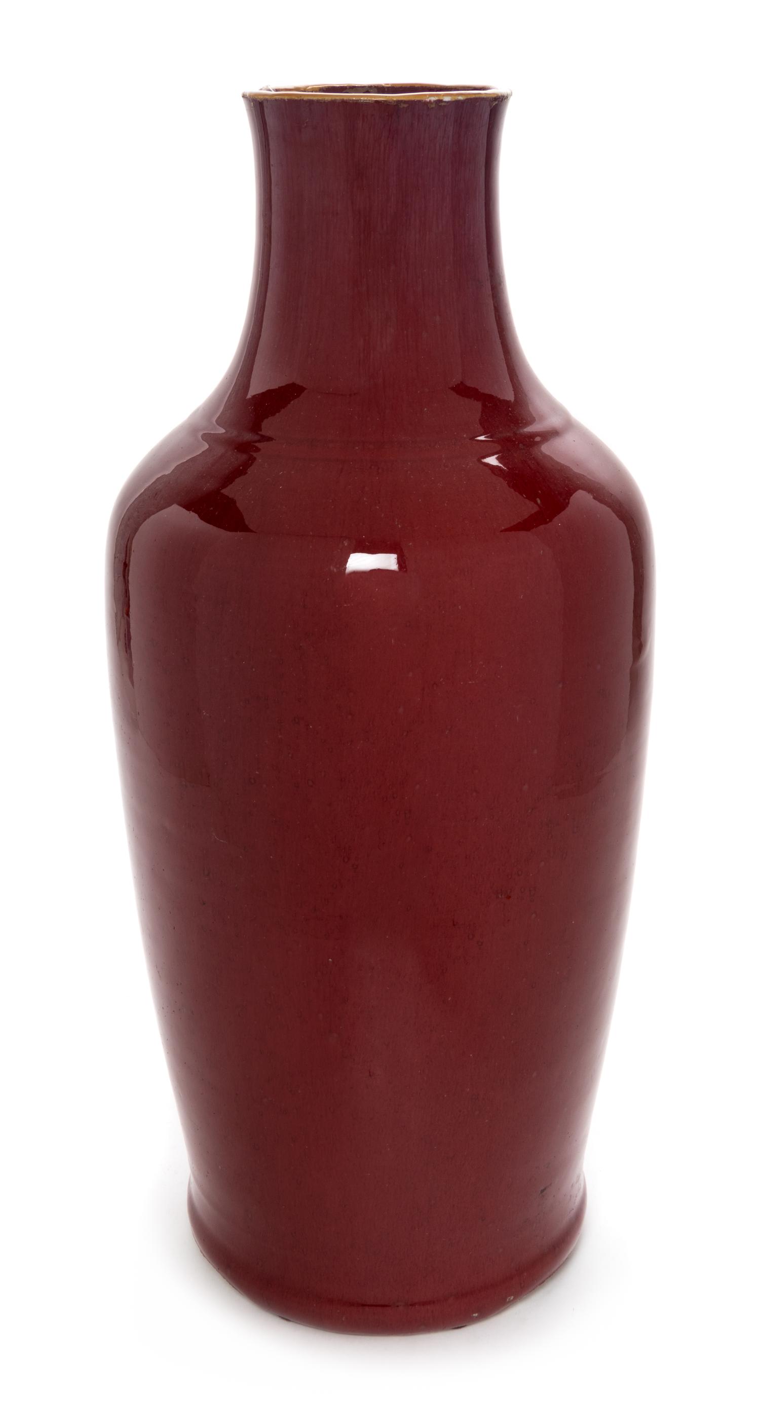 A Chinese Sang-de-Boeuf Glazed Porcelain Vase Height 21 1/2 inches. — 19TH CENTURY