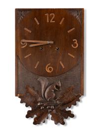 A Swiss "Black Forest" Carved Walnut Wall Clock