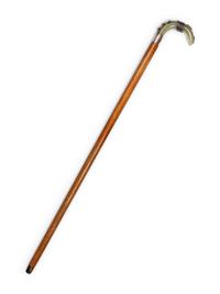 A Carved Onyx and Silver Mounted Malacca Walking Stick