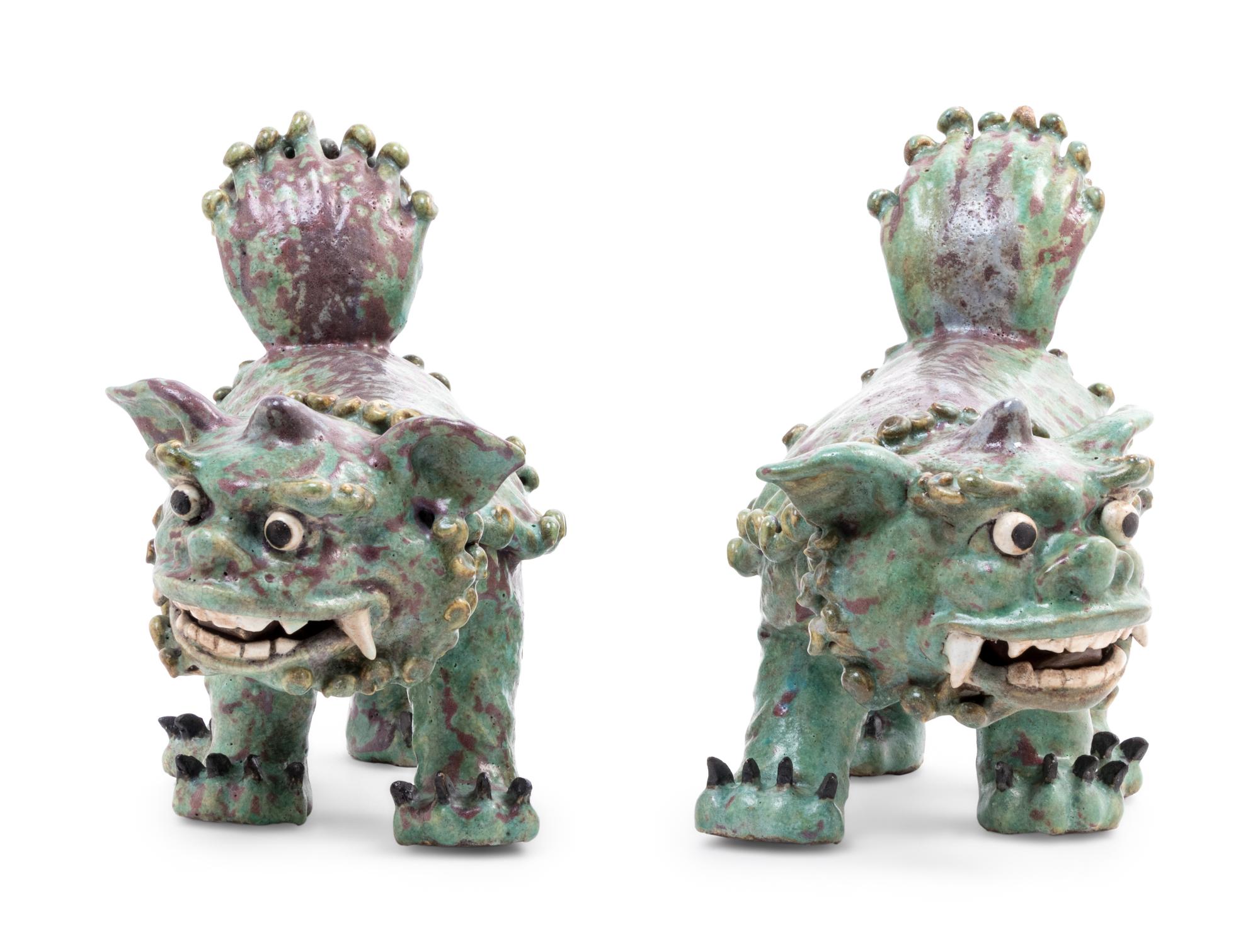 A Pair of Shiwan Red and Green Glazed Stoneware Figures of Fu Lions