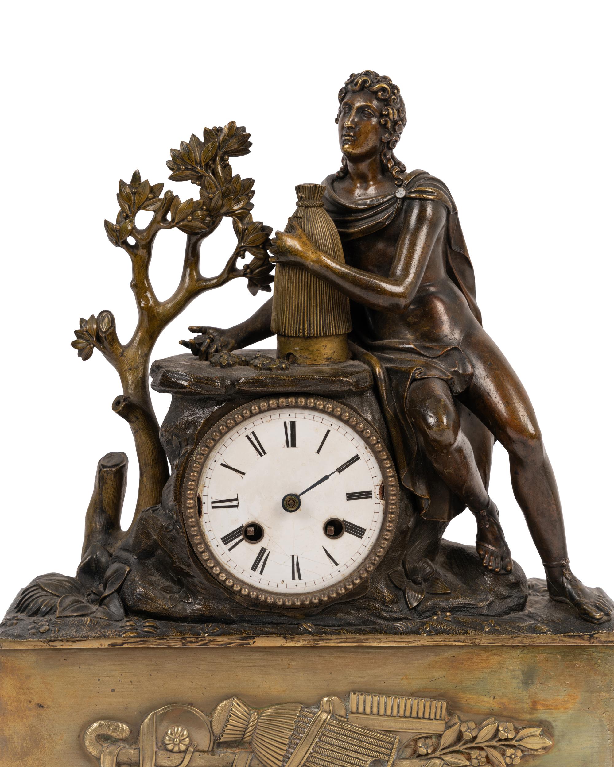An Empire Style Gilt and Patinated Bronze Figural Mantel Clock