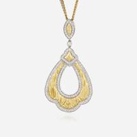 A bicolor gold and diamond pendant necklace