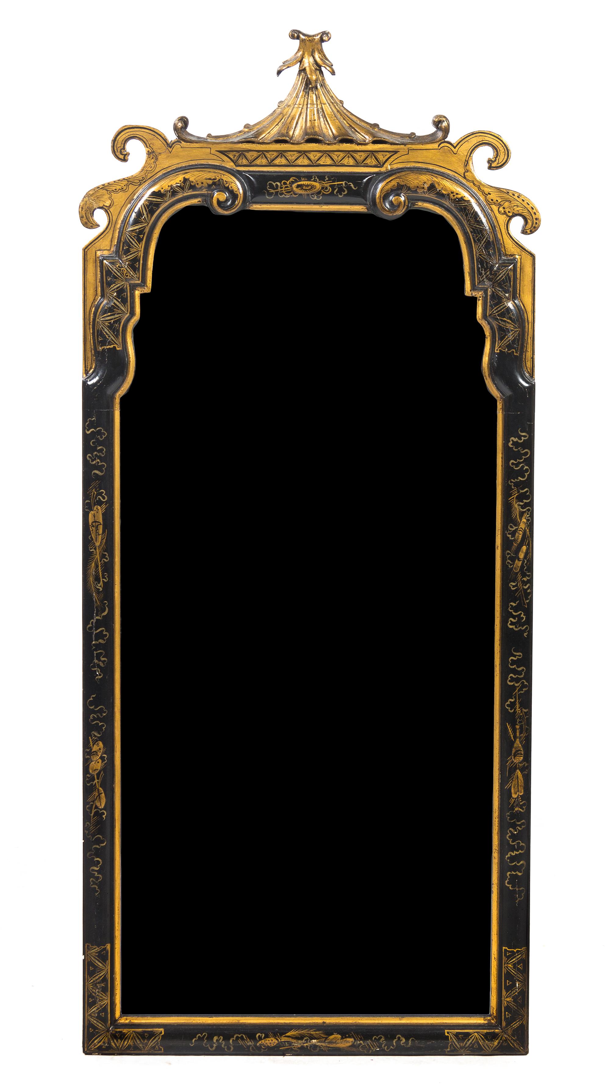 A Queen Anne Style Ebonized and Parcel Gilt Mirror, Height 46 1/2 x width 20 1/8 inches.
