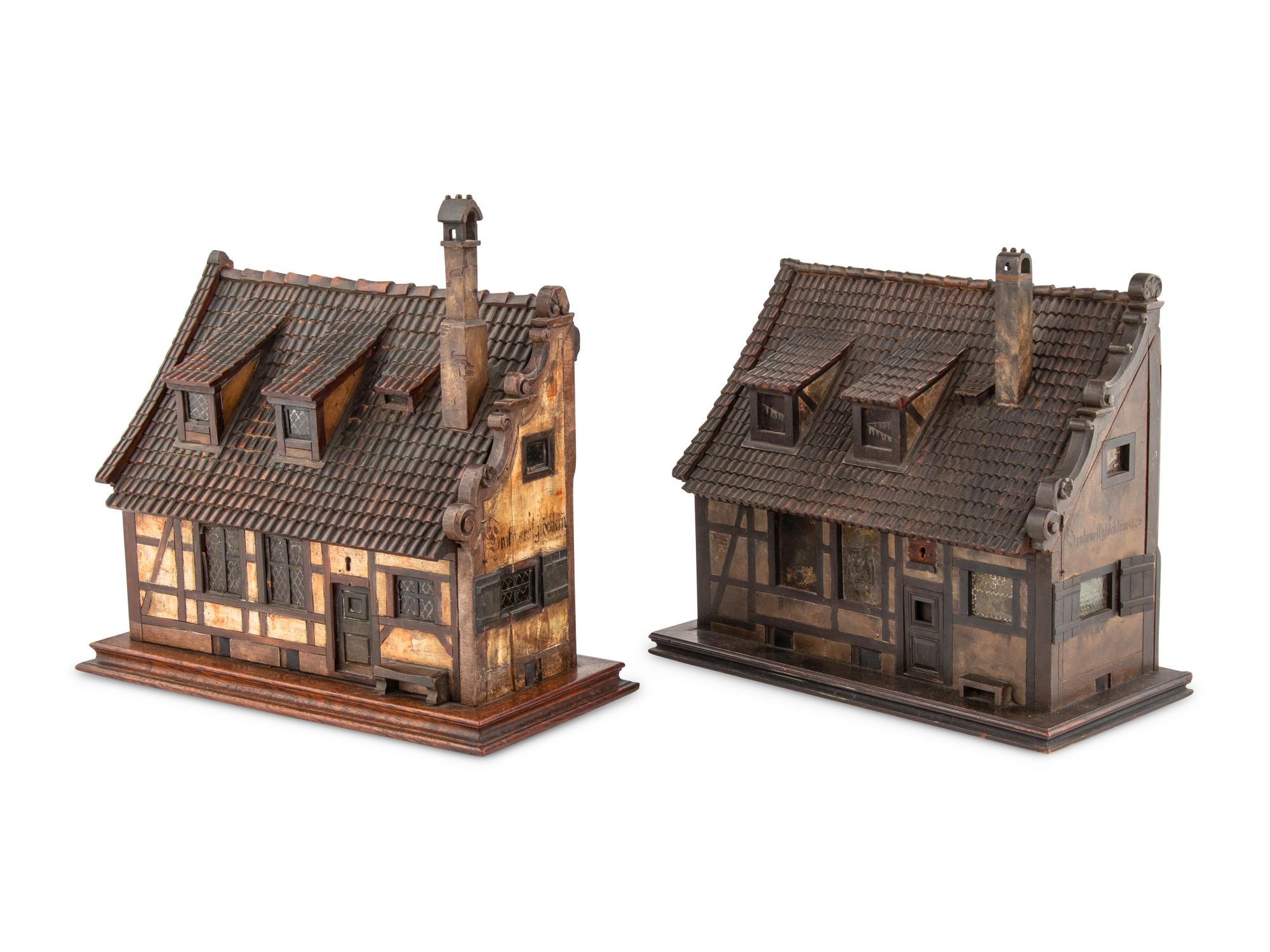 A Pair of German Carved and Painted Timber House-Form Boxes