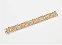 A Three-Tone Rose, White, and Yellow Gold and Multicolor Diamond Bracelet