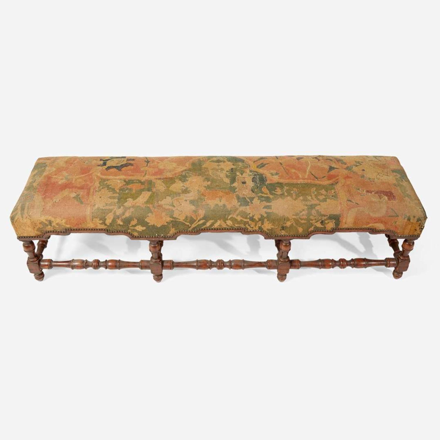 A Baroque Revival carved walnut bench with kilim upholstery late 19th / early 20th century