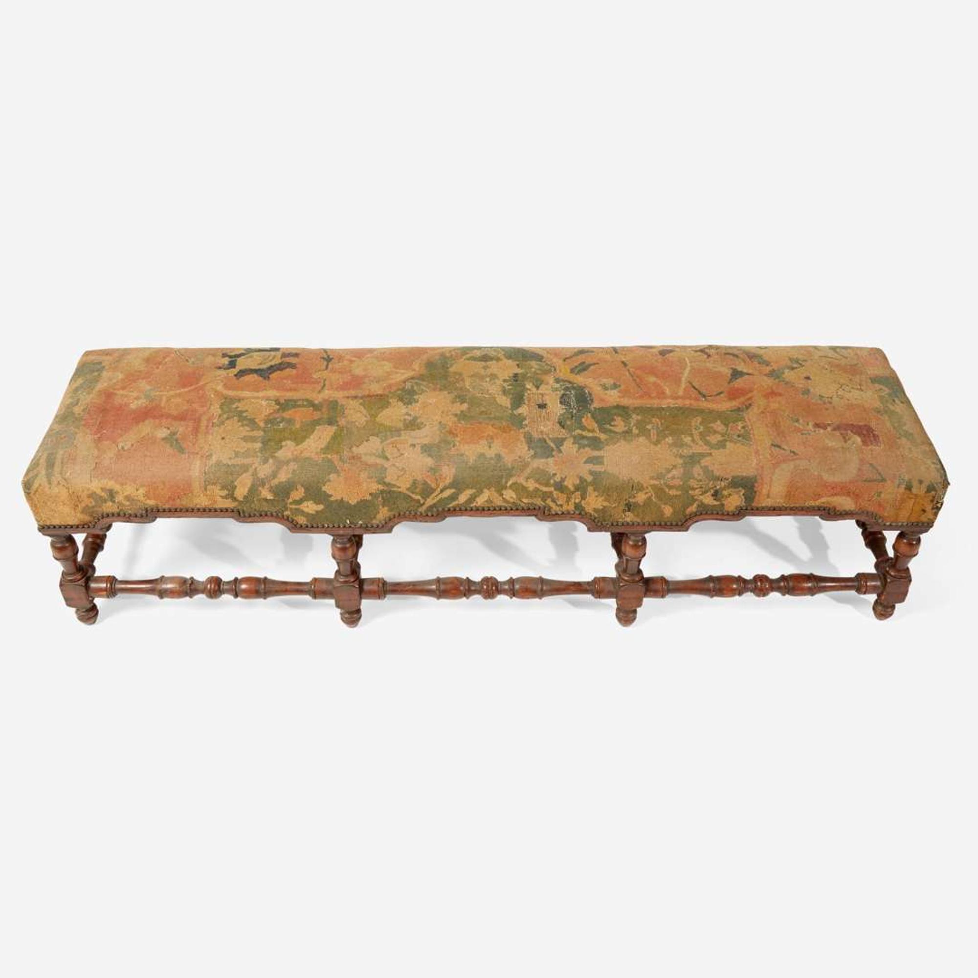 A Baroque Revival carved walnut bench with kilim upholstery late 19th / early 20th century