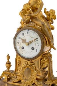 A French Gilt Bronze Figural Mantel Clock