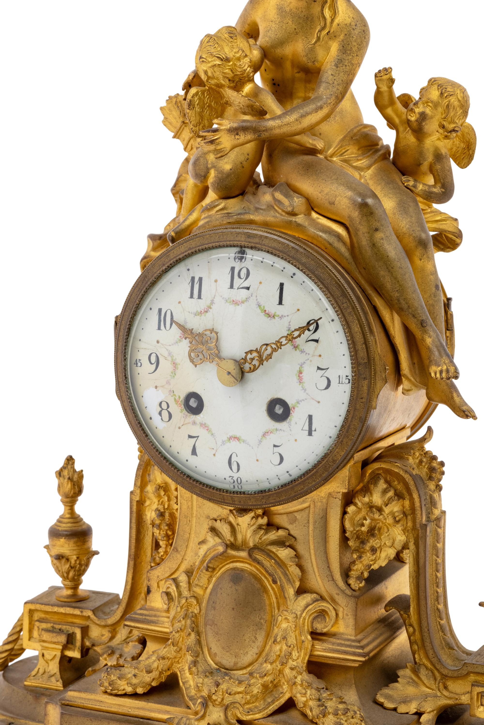 A French Gilt Bronze Figural Mantel Clock