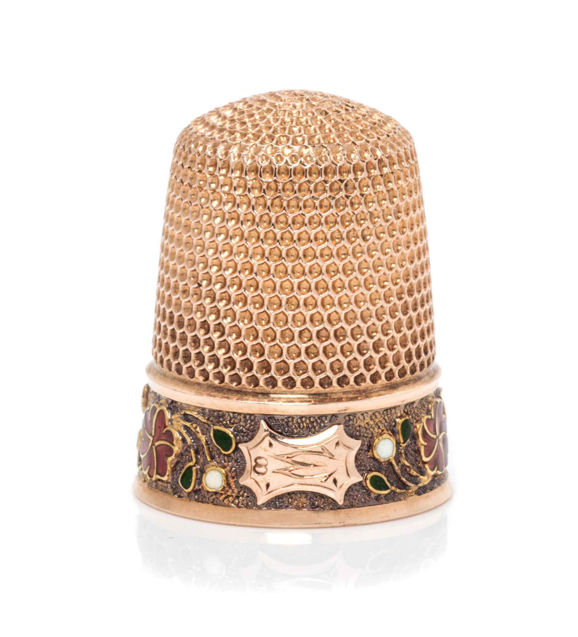 An American 14-Karat Rose Gold and Enamel Thimble, Simons Bros., Philadelphia, PA, the knurled top and body above a polychrome enamel f