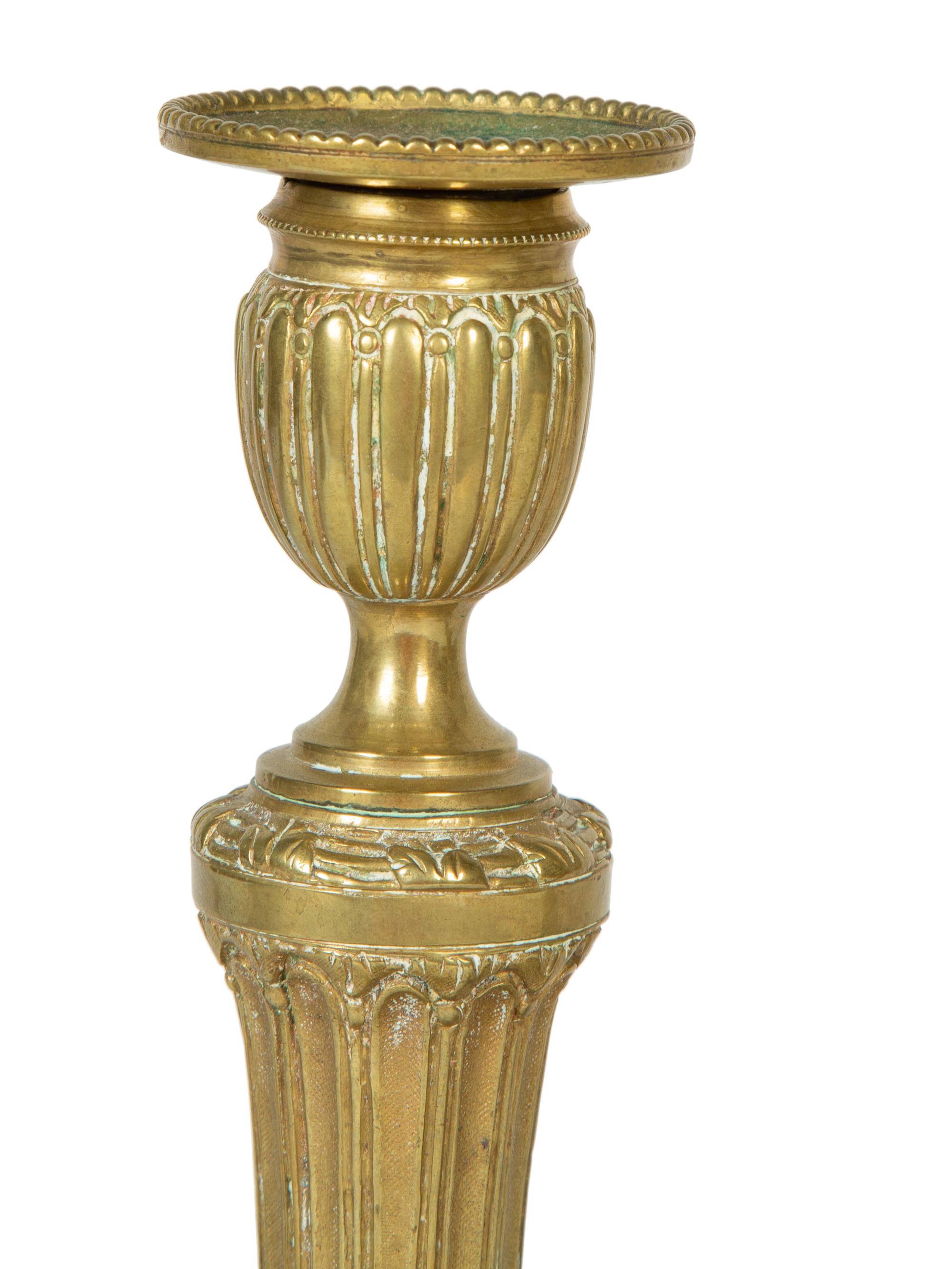 A Pair of Continental Brass Candlesticks