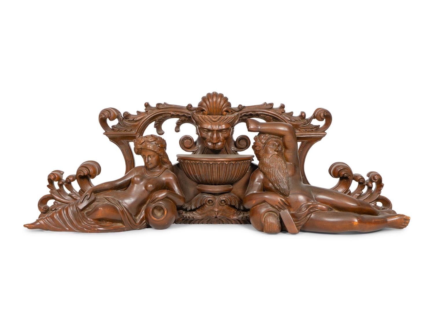 An Italian Renaissance Style Carved Mahogany Figural Transom