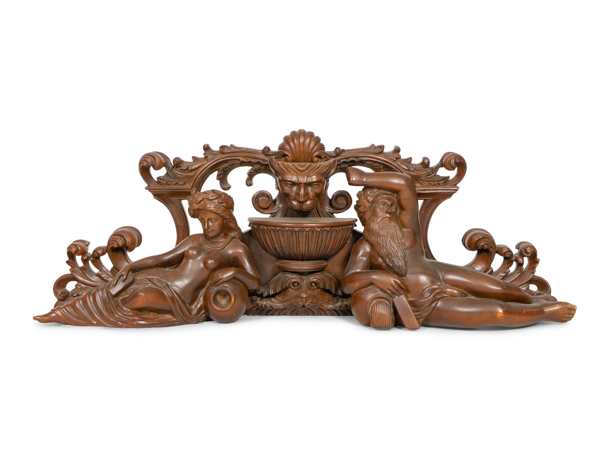 An Italian Renaissance Style Carved Mahogany Figural Transom