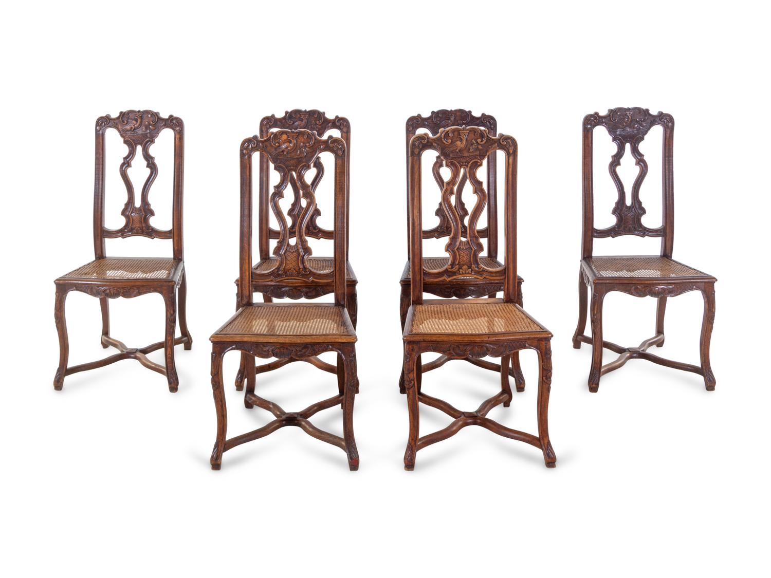 A Set of Six Italian Carved Oak Dining Chairs