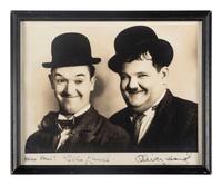 [HOLLYWOOD]. LAUREL, Stan (1890-1965) & HARDY, Oliver (1892-1957). Photograph signed by comedy duo Laurel & Hardy.