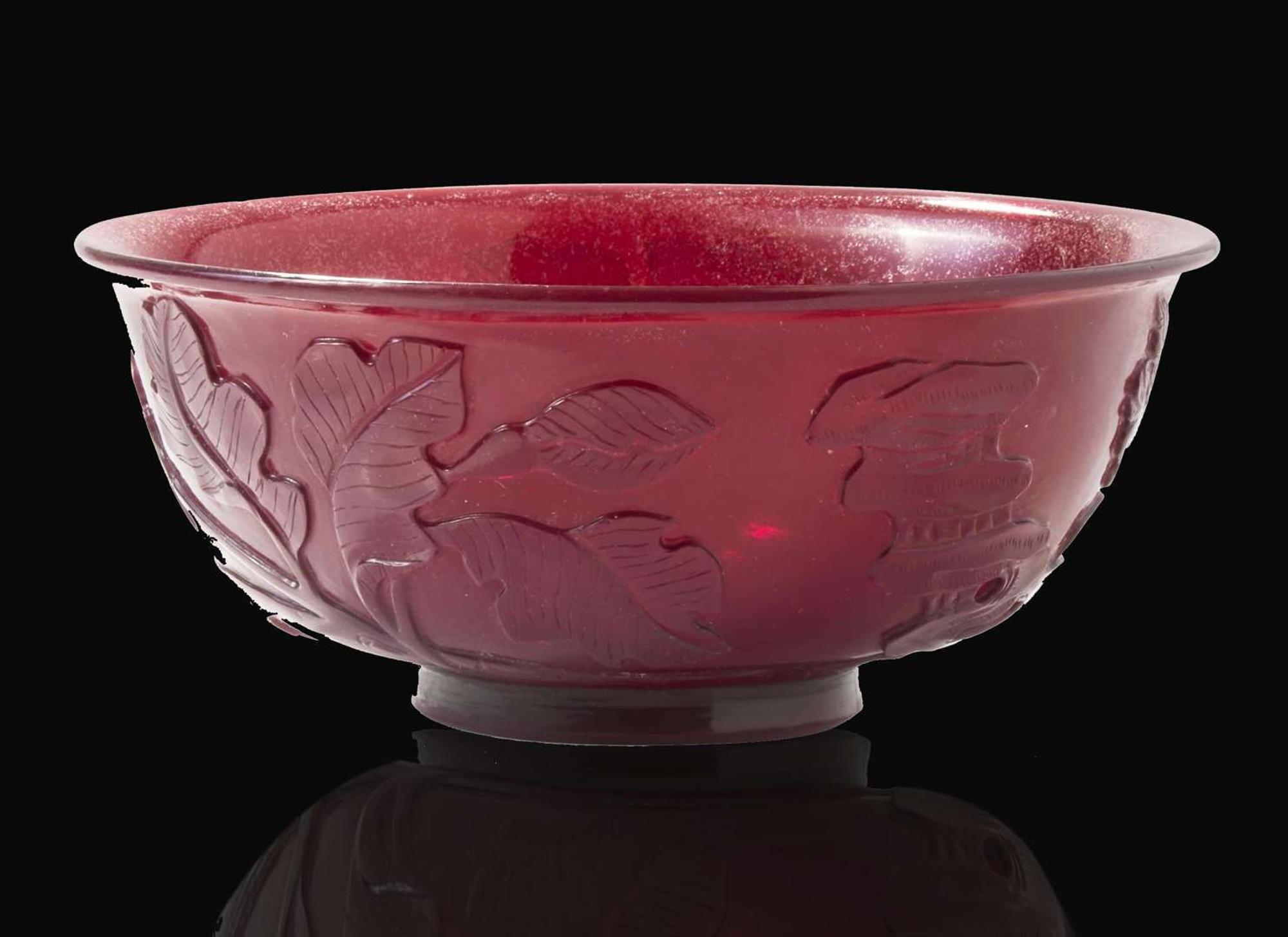 A Chinese carved ruby glass bowl, 18th century 紅琉璃盌配木底座 盌為十八世紀