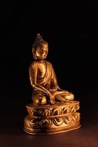 A Small Sino-Tibetan Gilt Bronze Figure of Seated Buddha Shakyamuni