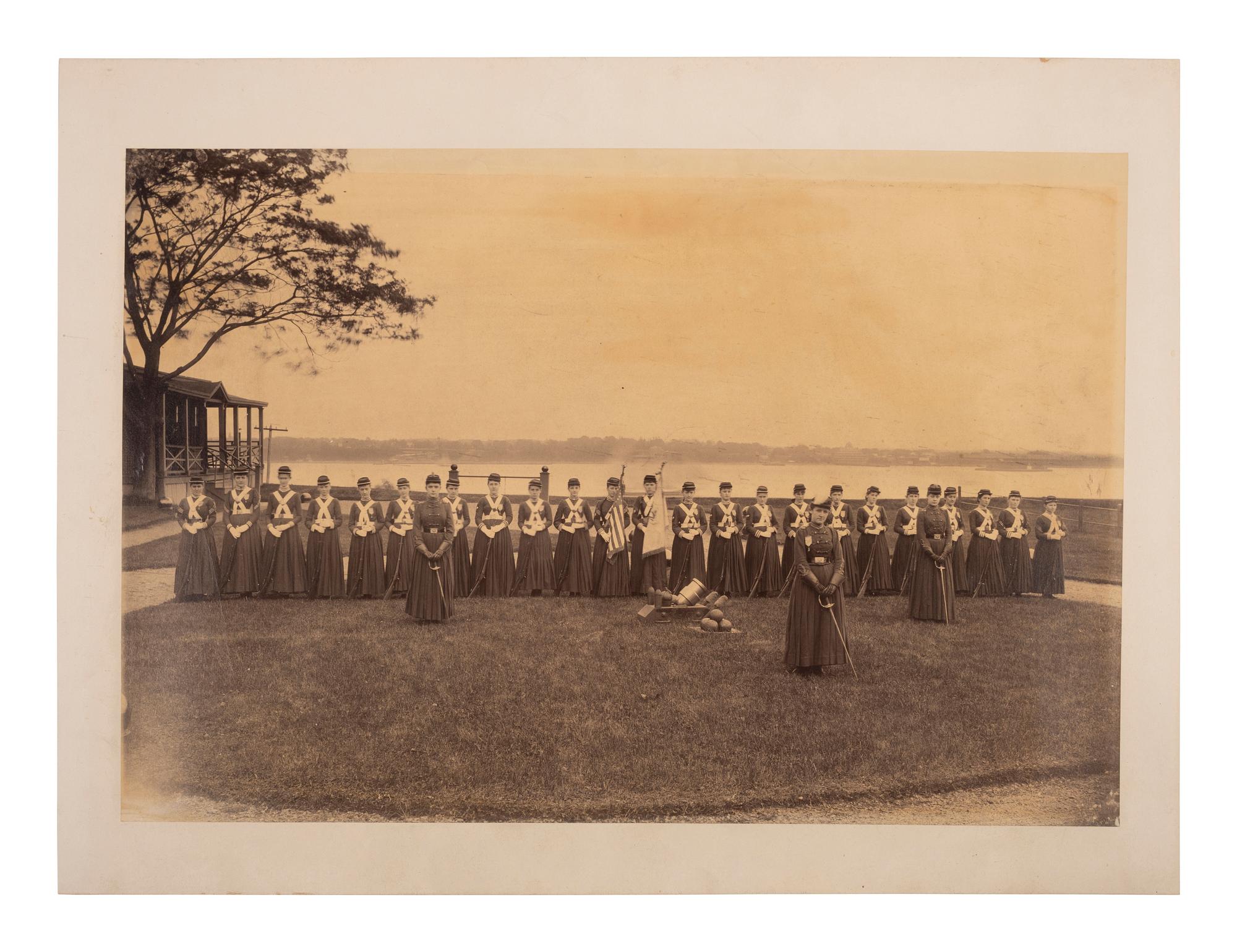 [EARLY PHOTOGRAPHY]. Large format photograph of a group of women in uniform and armed, possibly members of a home guard.