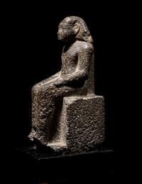 An Egyptian Diorite Seated Figure