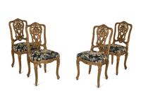 A Set of Four French Rococo Style Carved Gilt Wood Side Chairs