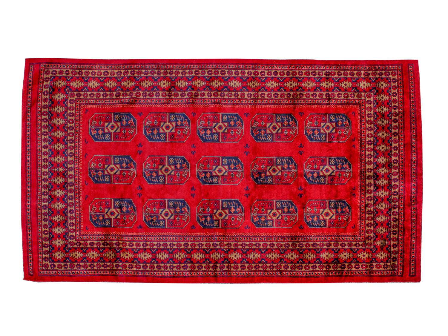 A Bokhara Wool Rug — 20TH CENTURY