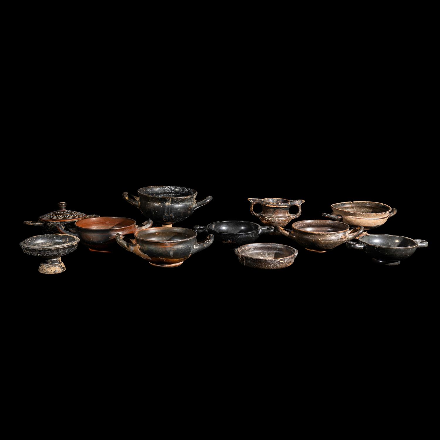 Eleven Greek Black-Glazed Vessels and Lids