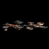 Eleven Greek Black-Glazed Vessels and Lids
